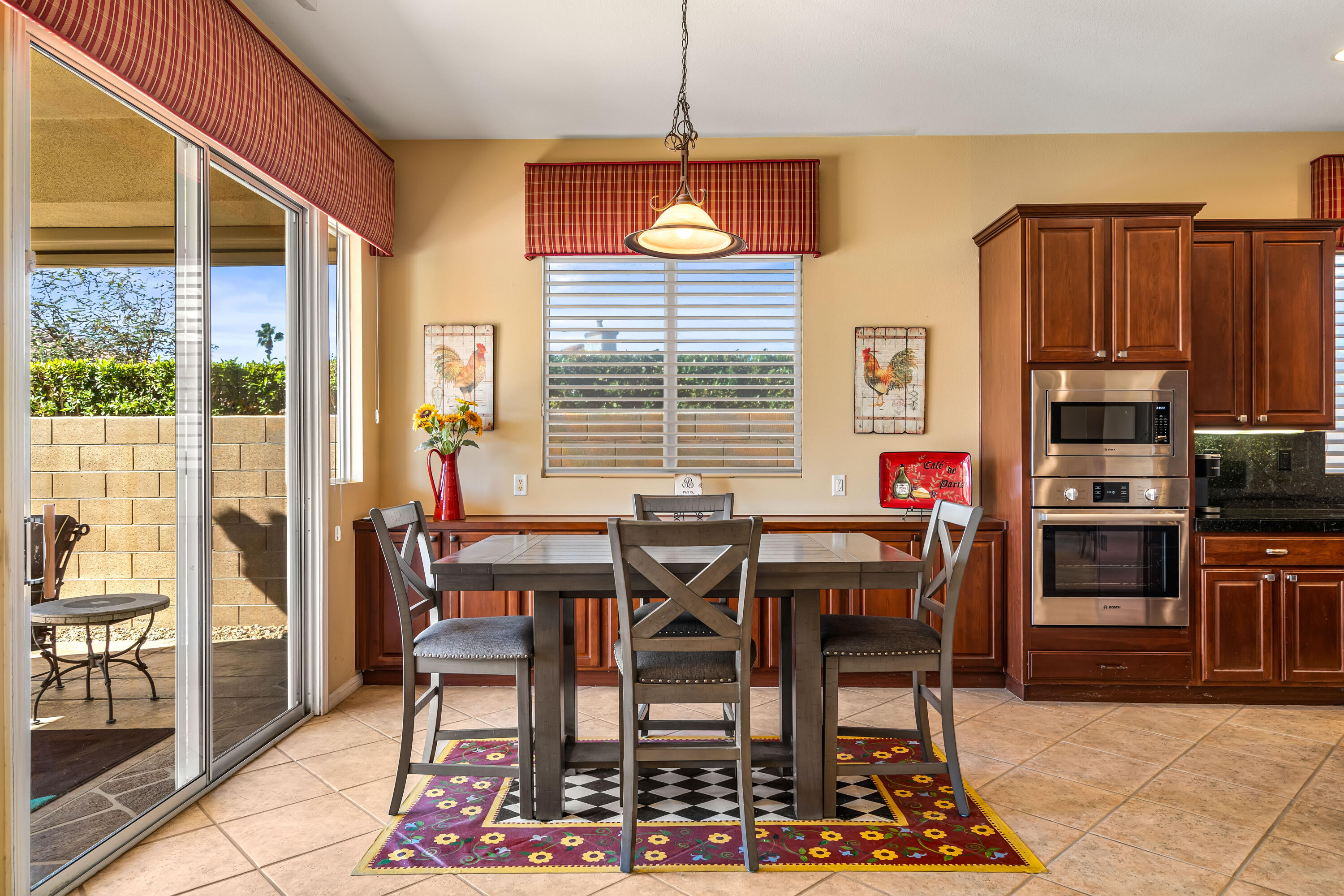 80607 Prestwick Place Indio, CA 92201 - Photo 20 of 68 a view of a dining room with furniture window and wooden floor