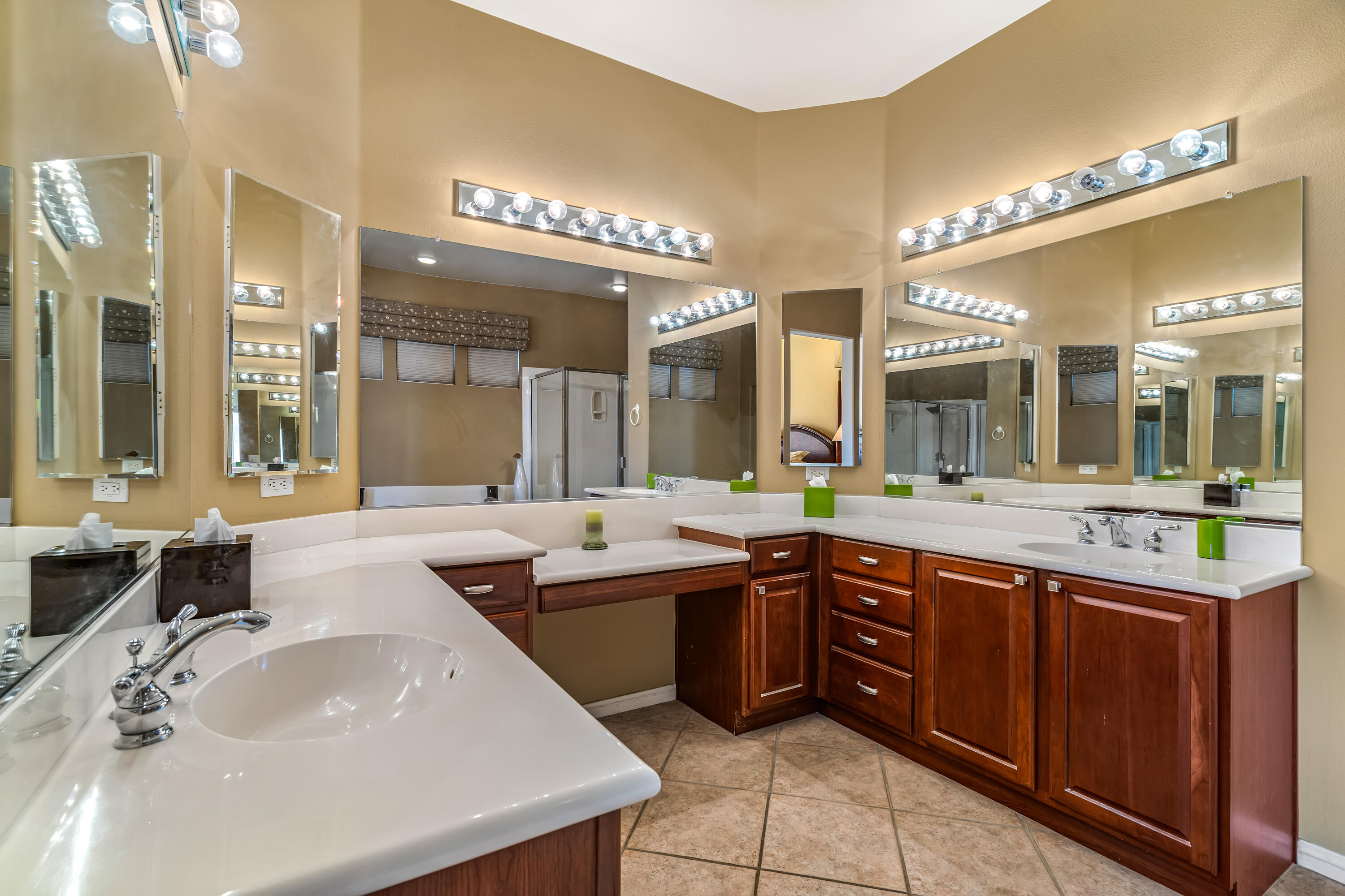 80607 Prestwick Place Indio, CA 92201 - Photo 31 of 68 a large bathroom with a sink and a large mirror of a bathroom