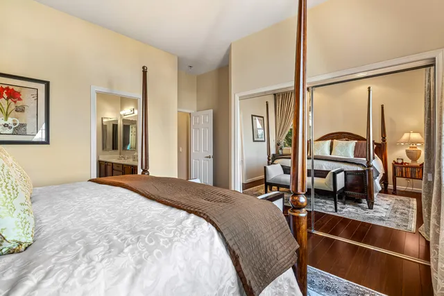 a bedroom with furniture and a floor to ceiling window