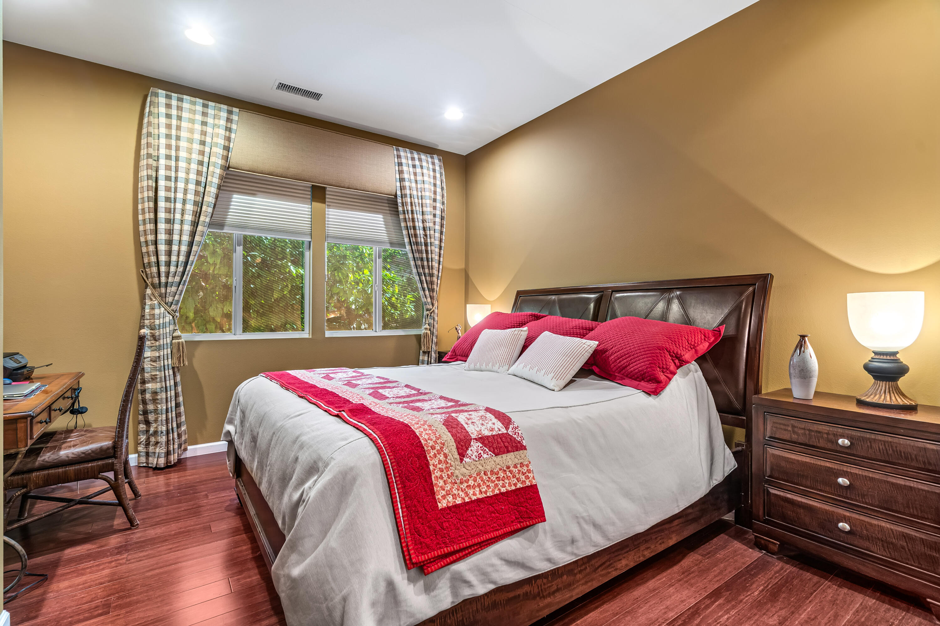 80607 Prestwick Place Indio, CA 92201 - Photo 40 of 68 a bedroom with a bed and wooden floor