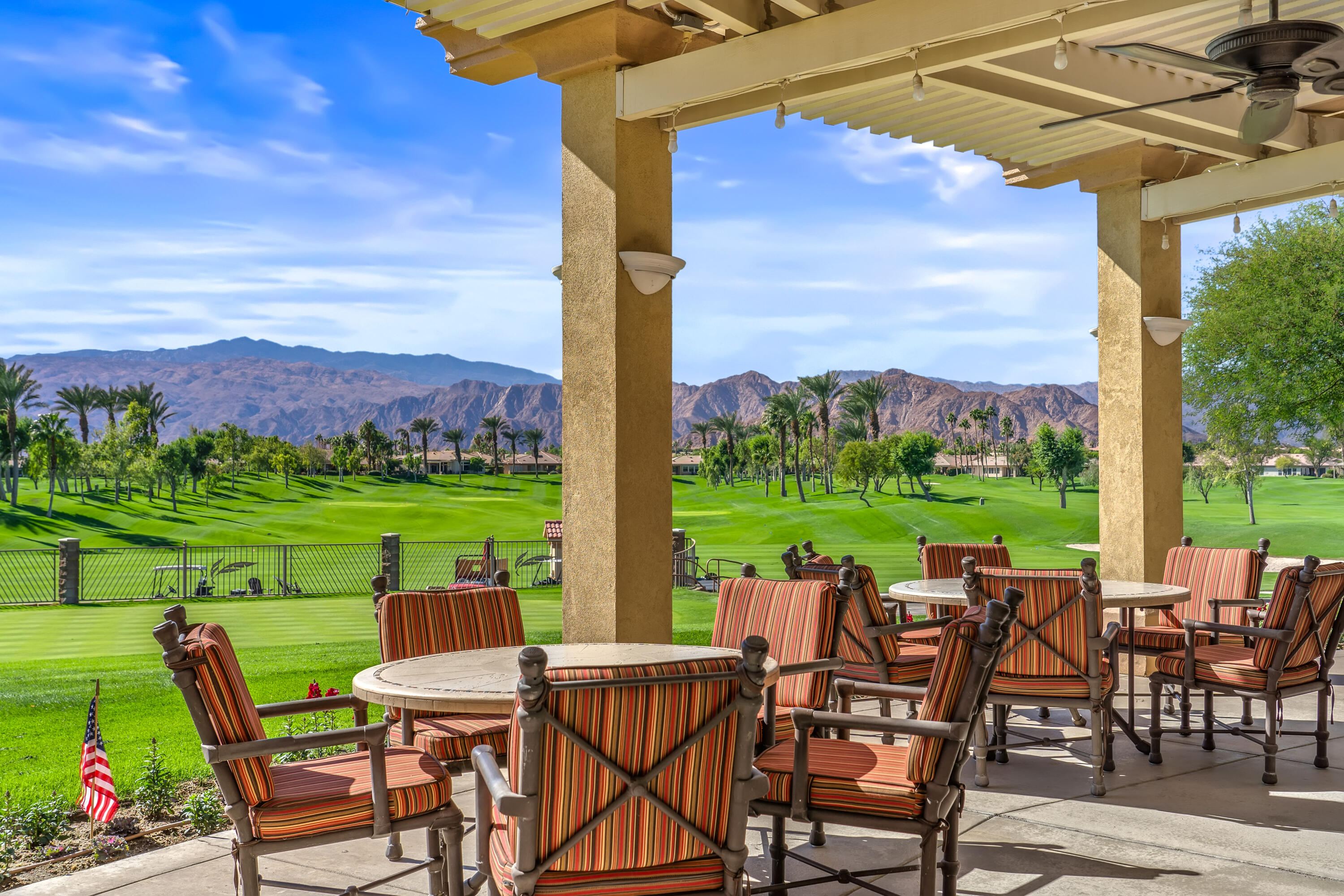 80607 Prestwick Place Indio, CA 92201 - Photo 59 of 68 a view of an chairs and table in patio with a yard