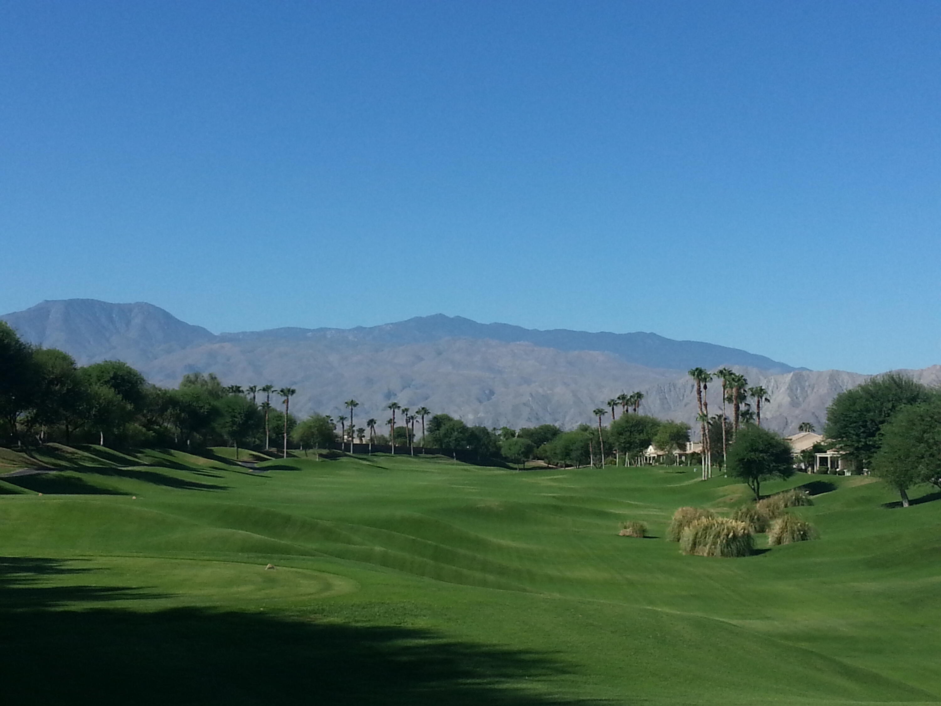 80607 Prestwick Place Indio, CA 92201 - Photo 67 of 68 a view of a grassy field with mountains in the background
