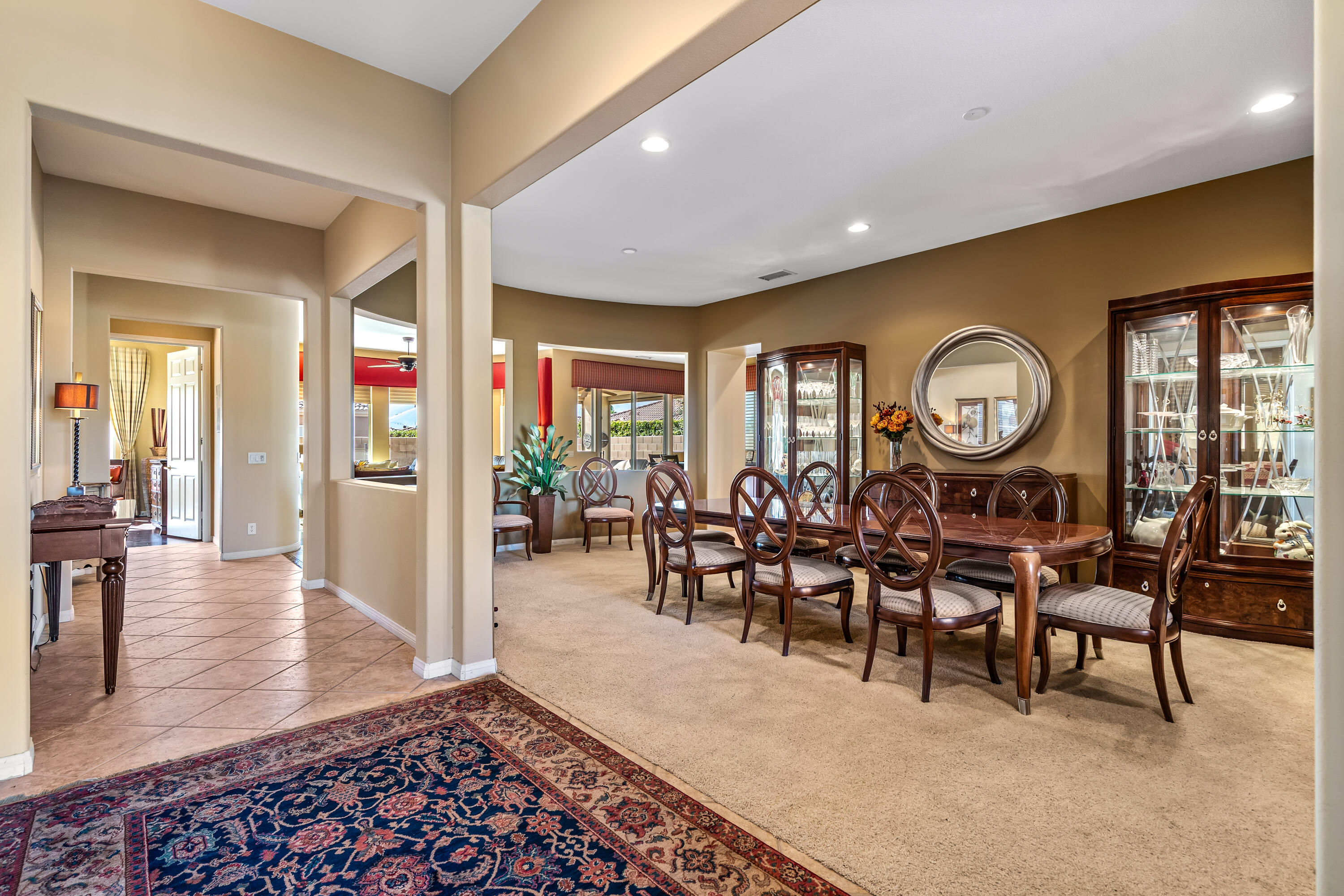 80607 Prestwick Place Indio, CA 92201 - Photo 8 of 68 a view of a dining room with furniture and a large window