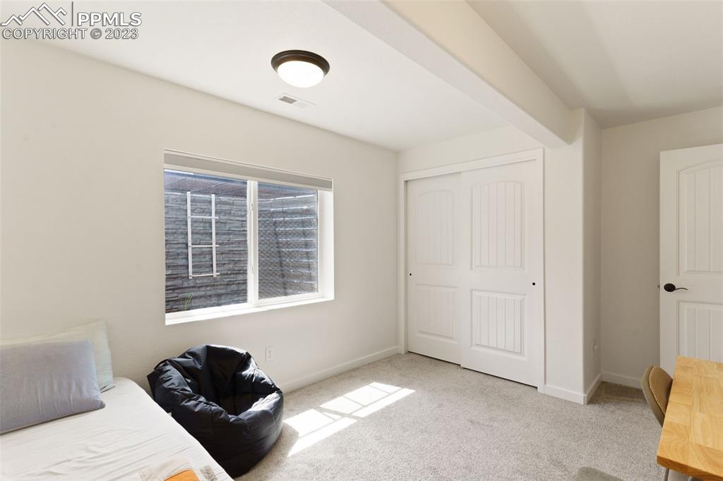 11969 Alydar Loop Colorado Springs, CO 80921 - Photo 22 of 39 a living room with furniture and a window