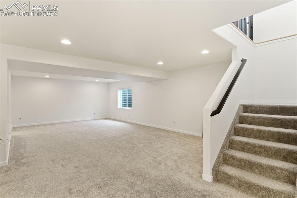 11969 Alydar Loop Colorado Springs, CO 80921 - Photo 30 of 39 a view of an empty room with stairs