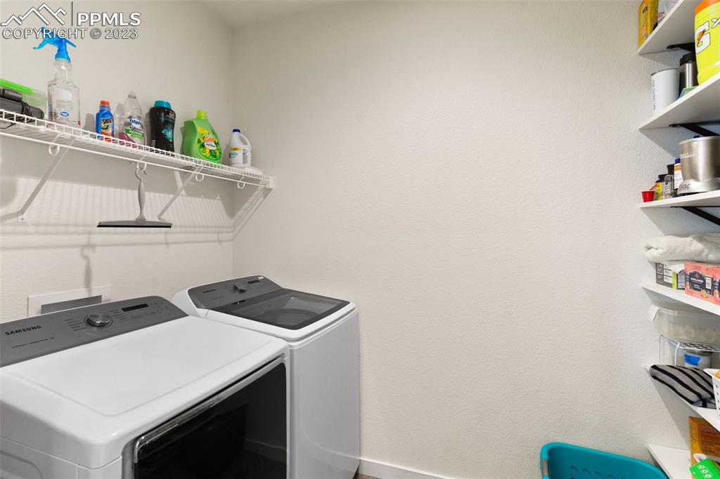 11969 Alydar Loop Colorado Springs, CO 80921 - Photo 36 of 39 a utility room with dryer and washer
