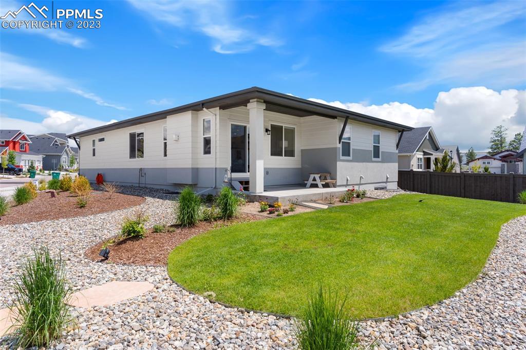 11969 Alydar Loop Colorado Springs, CO 80921 - Photo 38 of 39 a front view of a house with garden