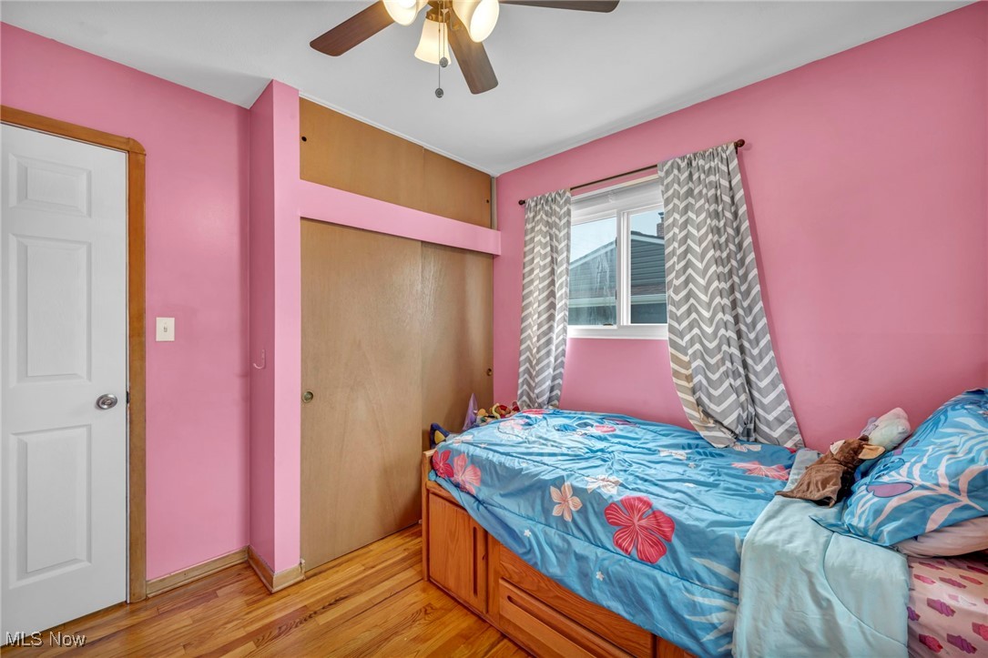 15025 Holland Road Brook Park, OH 44142 - Photo 7 of 12 Bedroom with light wood-type flooring, a closet, and ceiling fan