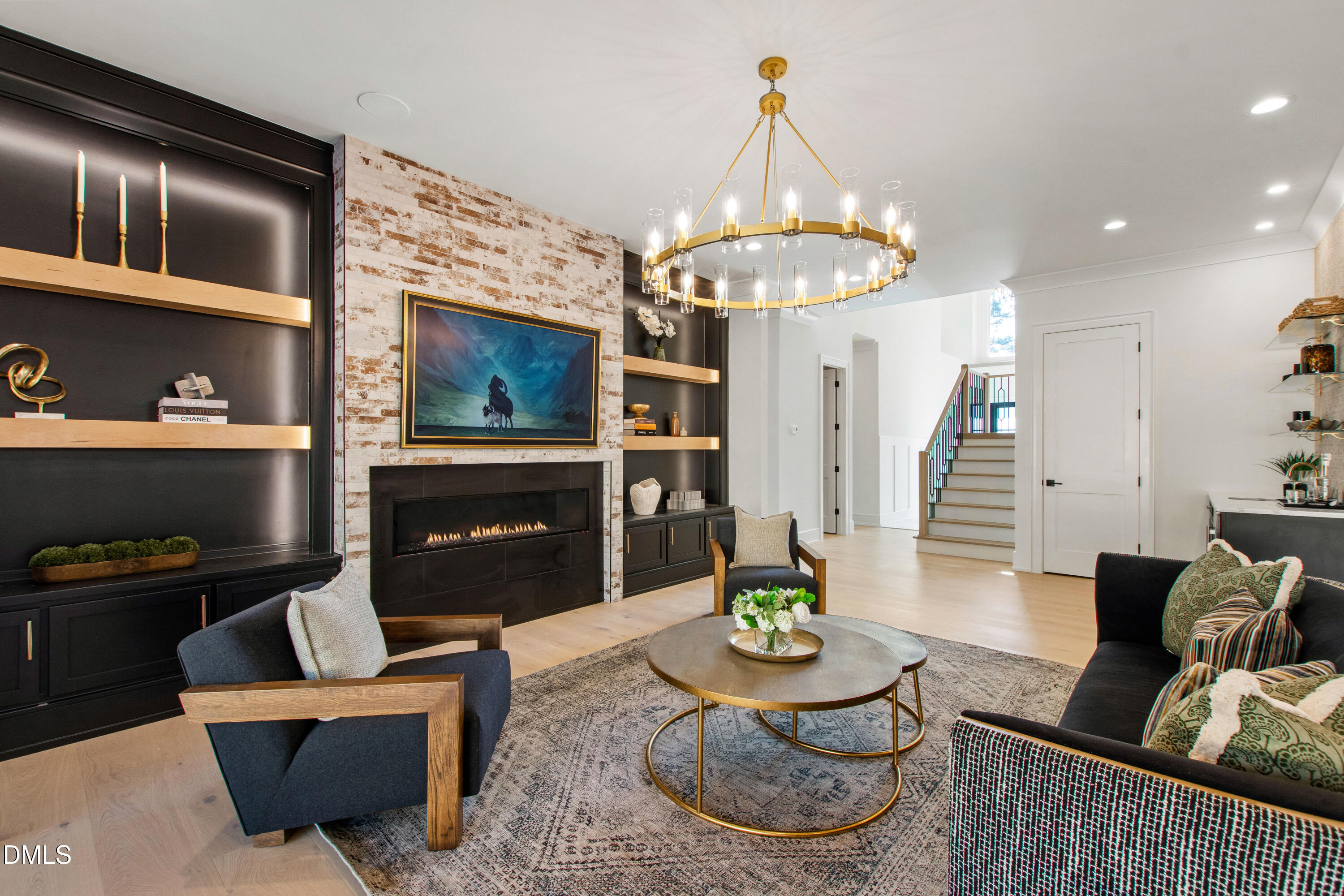 405 Latimer Road Raleigh, NC 27609 - Photo 12 of 100 a living room with furniture a fireplace and a chandelier