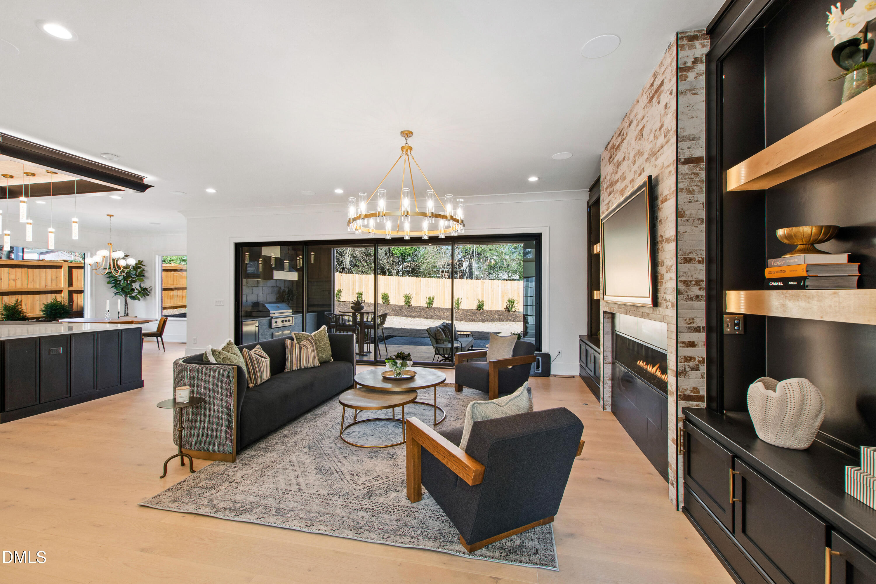 405 Latimer Road Raleigh, NC 27609 - Photo 14 of 100 a living room with fireplace furniture and a chandelier