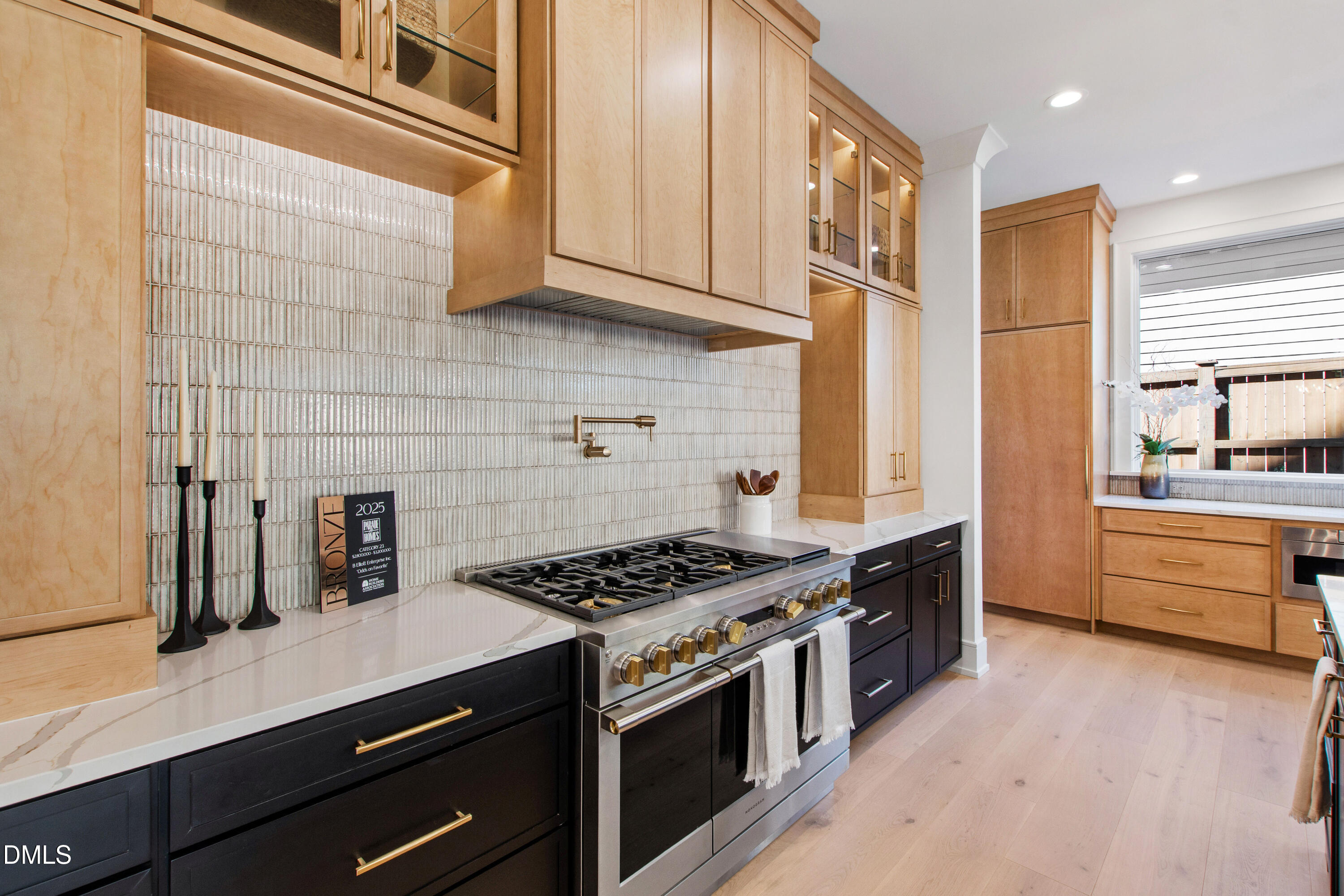405 Latimer Road Raleigh, NC 27609 - Photo 24 of 100 a kitchen with stainless steel appliances a stove a sink and a refrigerator