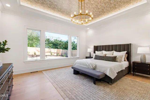 a living room with furniture potted plant and window
