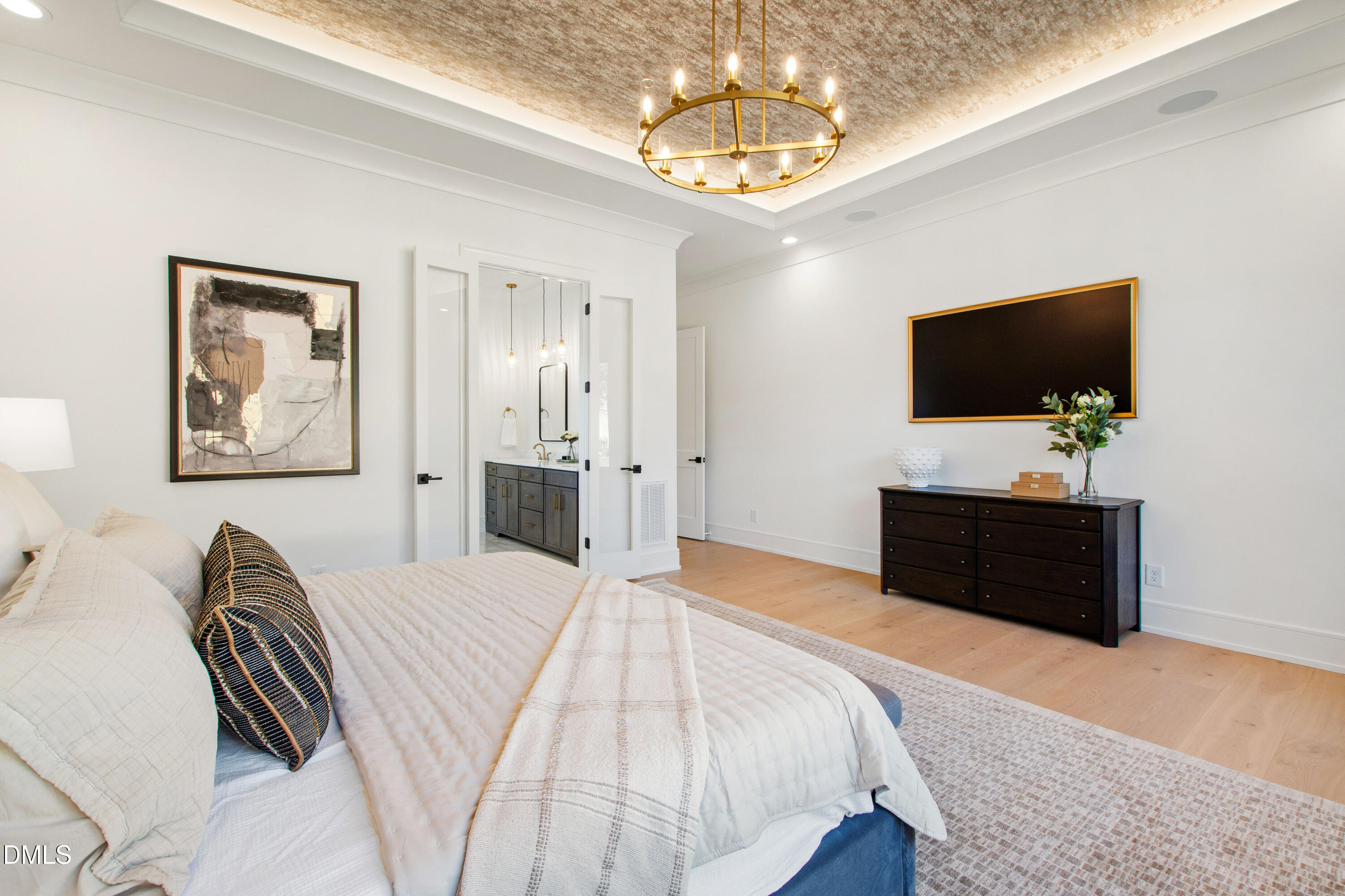 405 Latimer Road Raleigh, NC 27609 - Photo 34 of 100 a bedroom with a bed and a flat screen tv