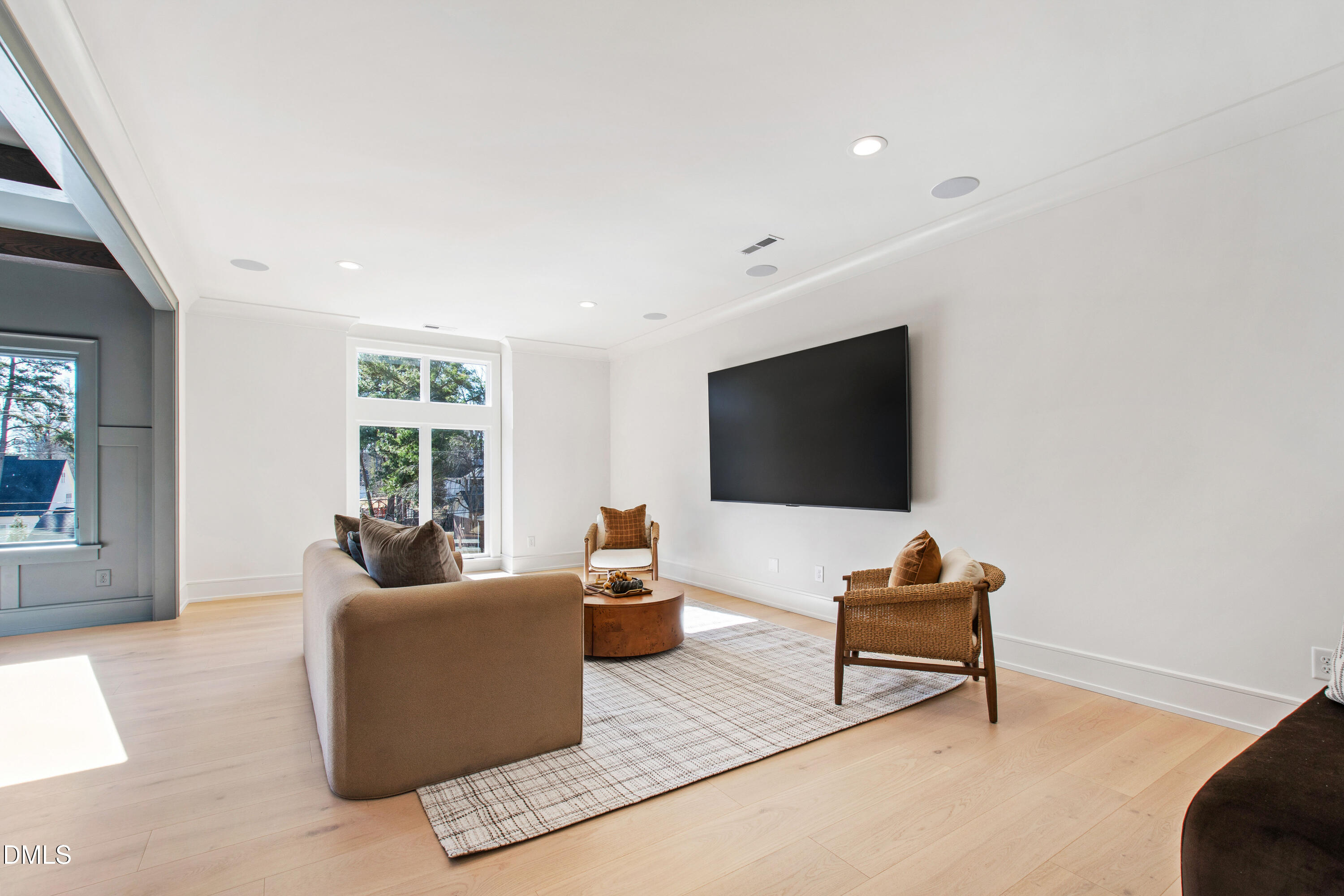 405 Latimer Road Raleigh, NC 27609 - Photo 46 of 100 a living room with furniture and a flat screen tv