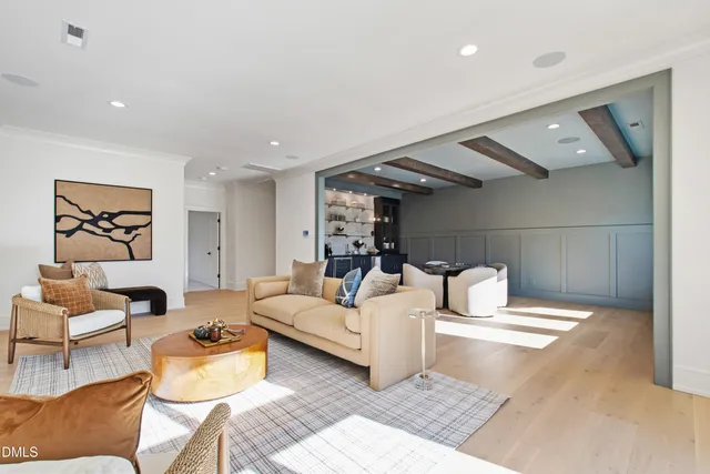 a view of a house with backyard porch and sitting area