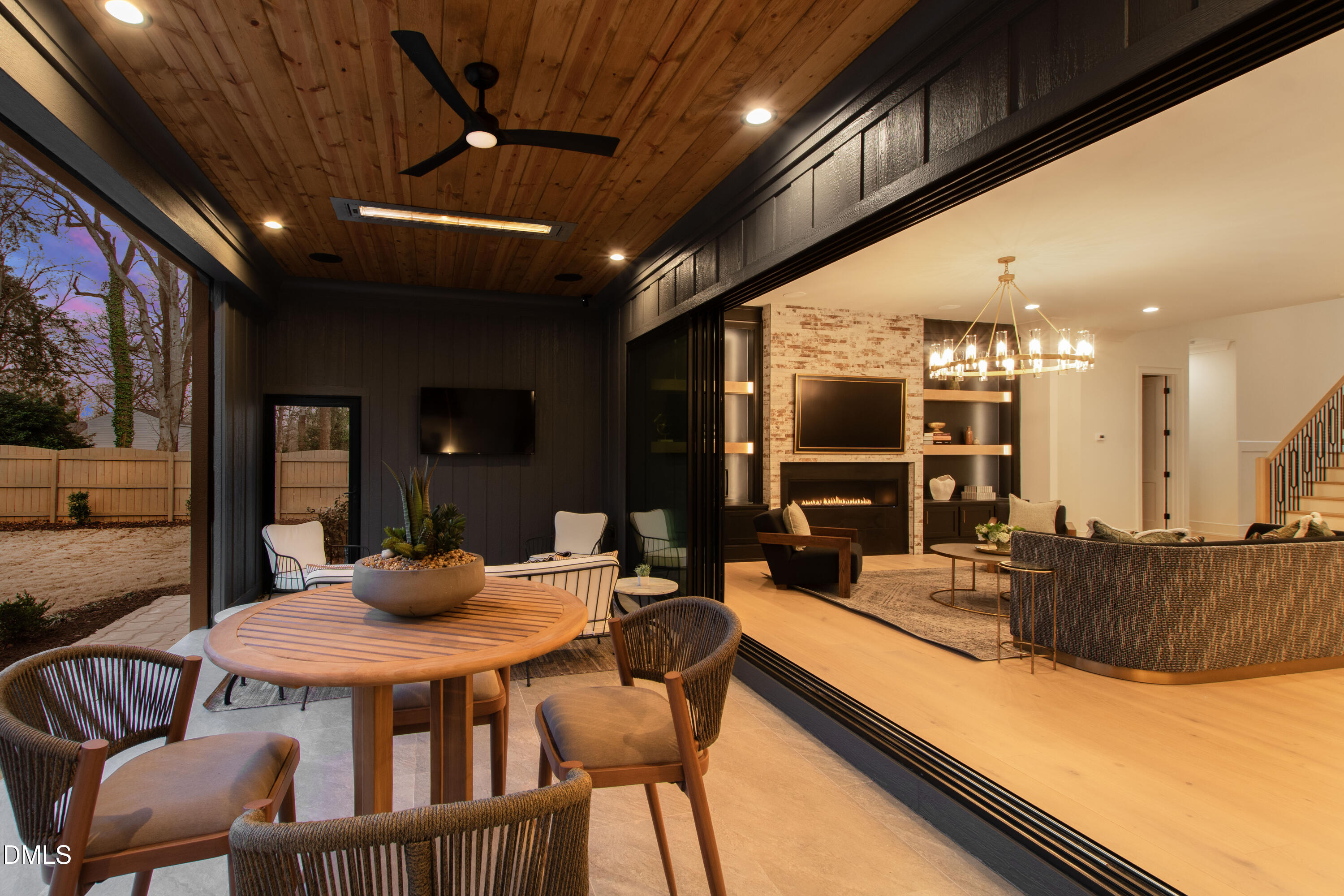 405 Latimer Road Raleigh, NC 27609 - Photo 4 of 100 a dining hall with stainless steel appliances kitchen island granite countertop a dining table and chairs with the floor to ceiling window