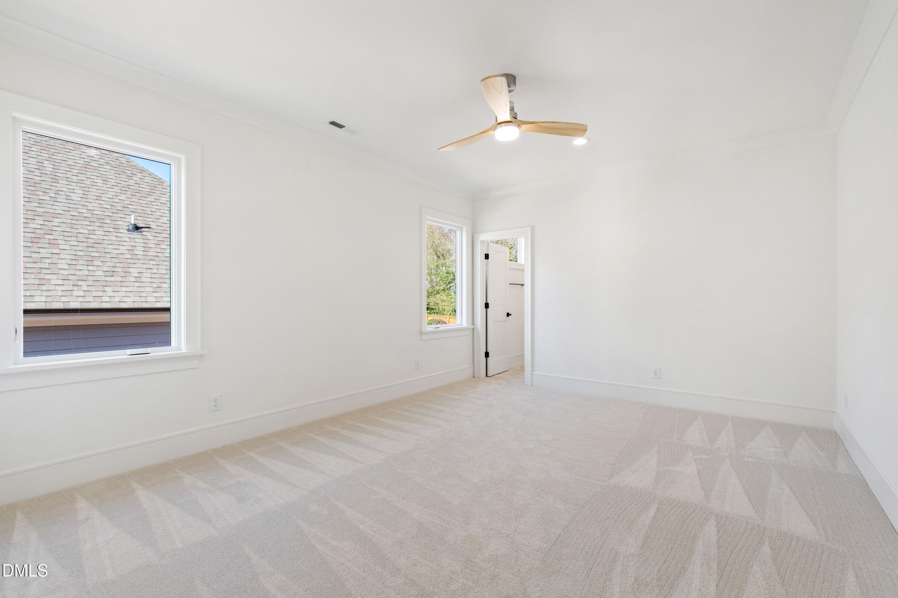 405 Latimer Road Raleigh, NC 27609 - Photo 52 of 100 an empty room with windows and fan