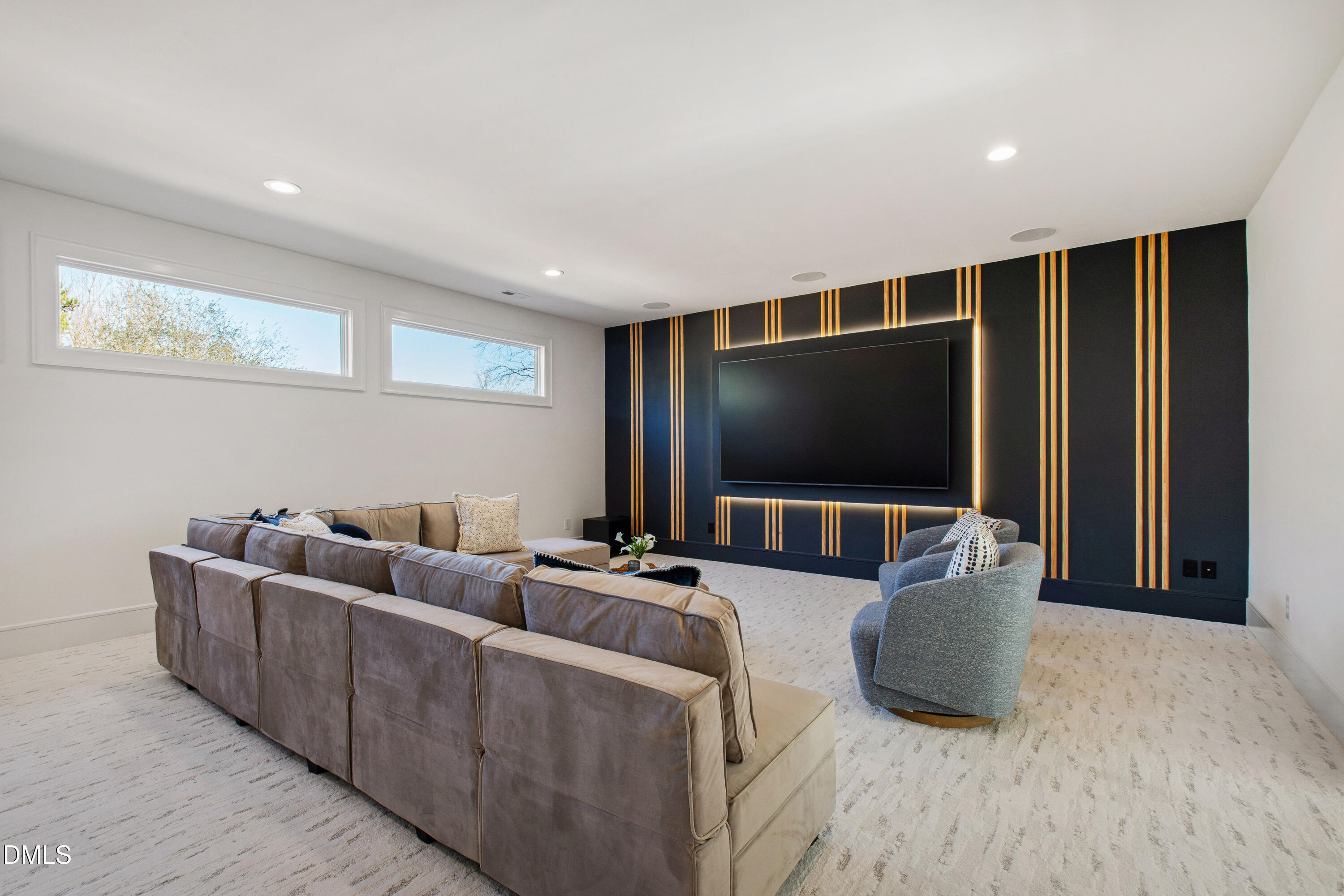 405 Latimer Road Raleigh, NC 27609 - Photo 57 of 100 a living room with furniture and a flat screen tv