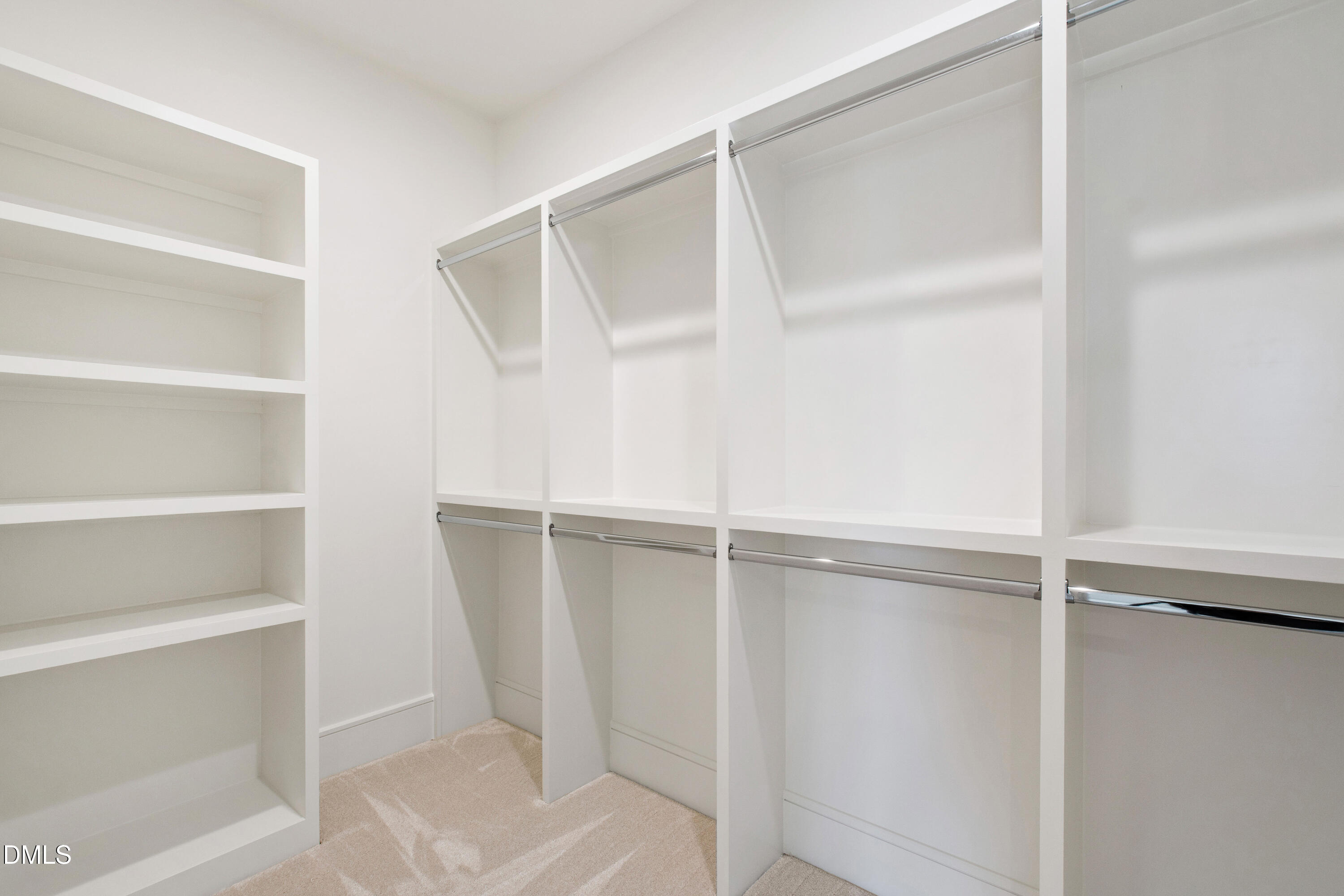 405 Latimer Road Raleigh, NC 27609 - Photo 69 of 100 a view of walk in closet with empty racks