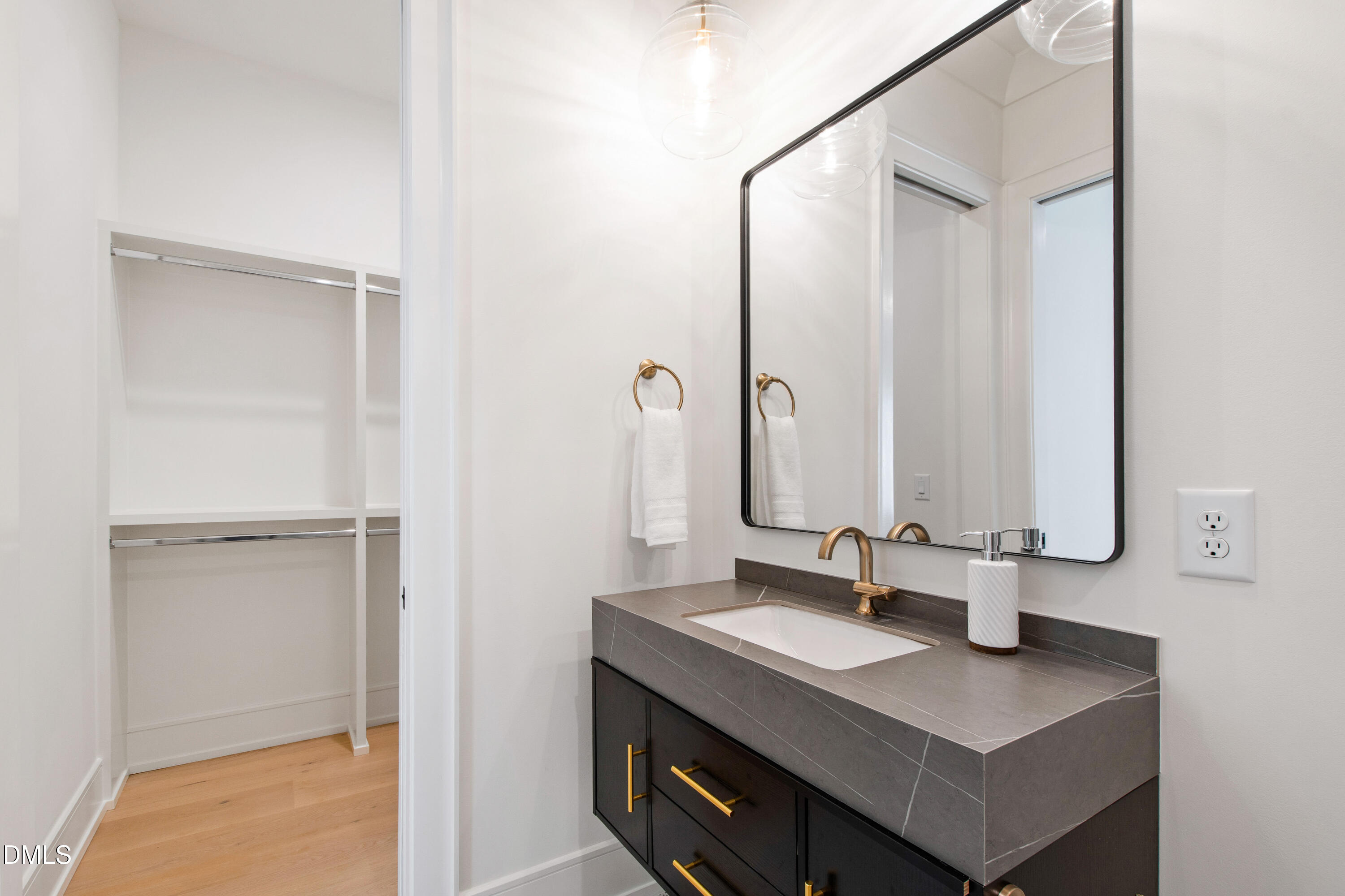 405 Latimer Road Raleigh, NC 27609 - Photo 74 of 100 a bathroom with a sink and a mirror