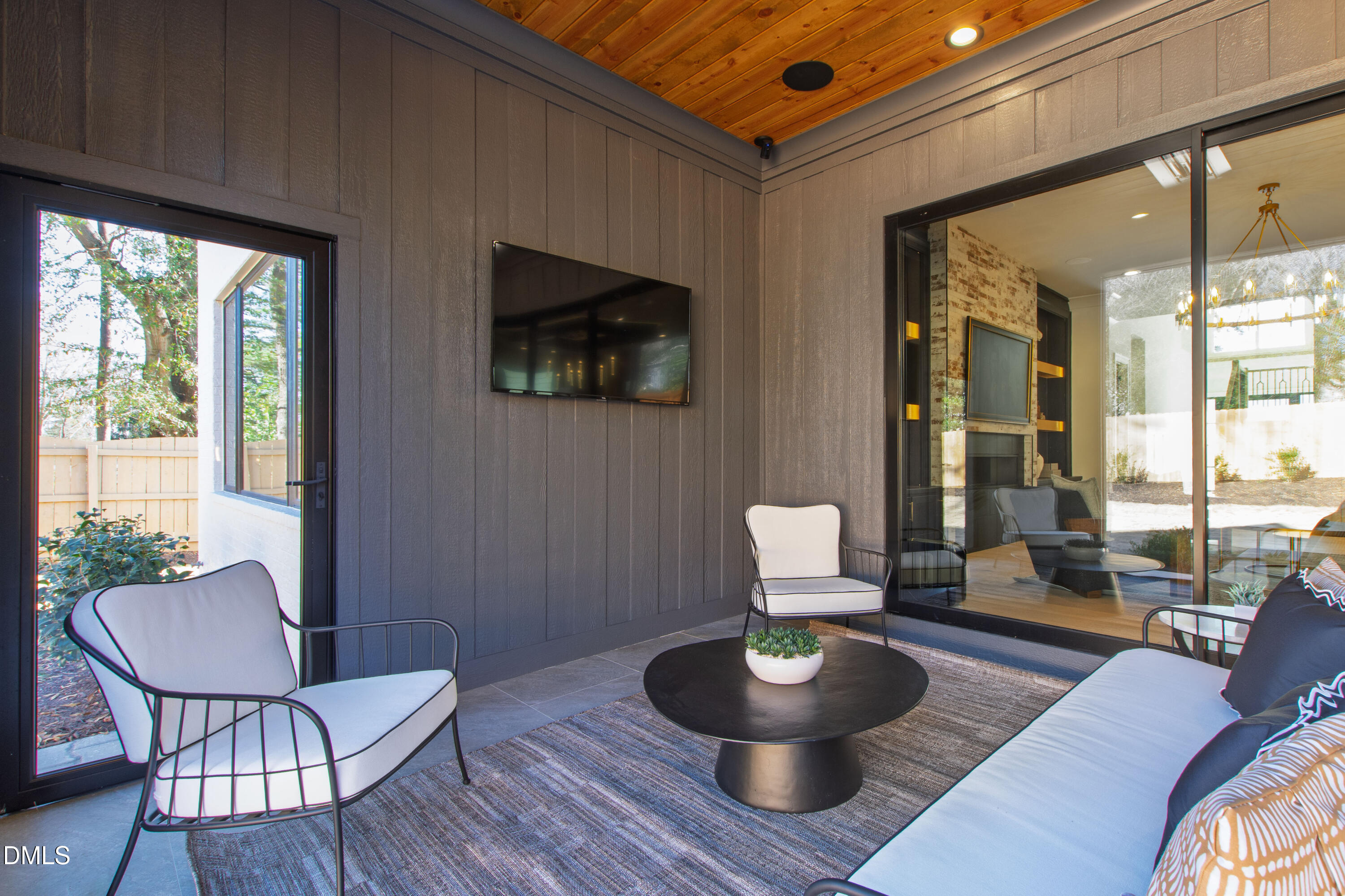 405 Latimer Road Raleigh, NC 27609 - Photo 86 of 100 a living room with furniture and a potted plant