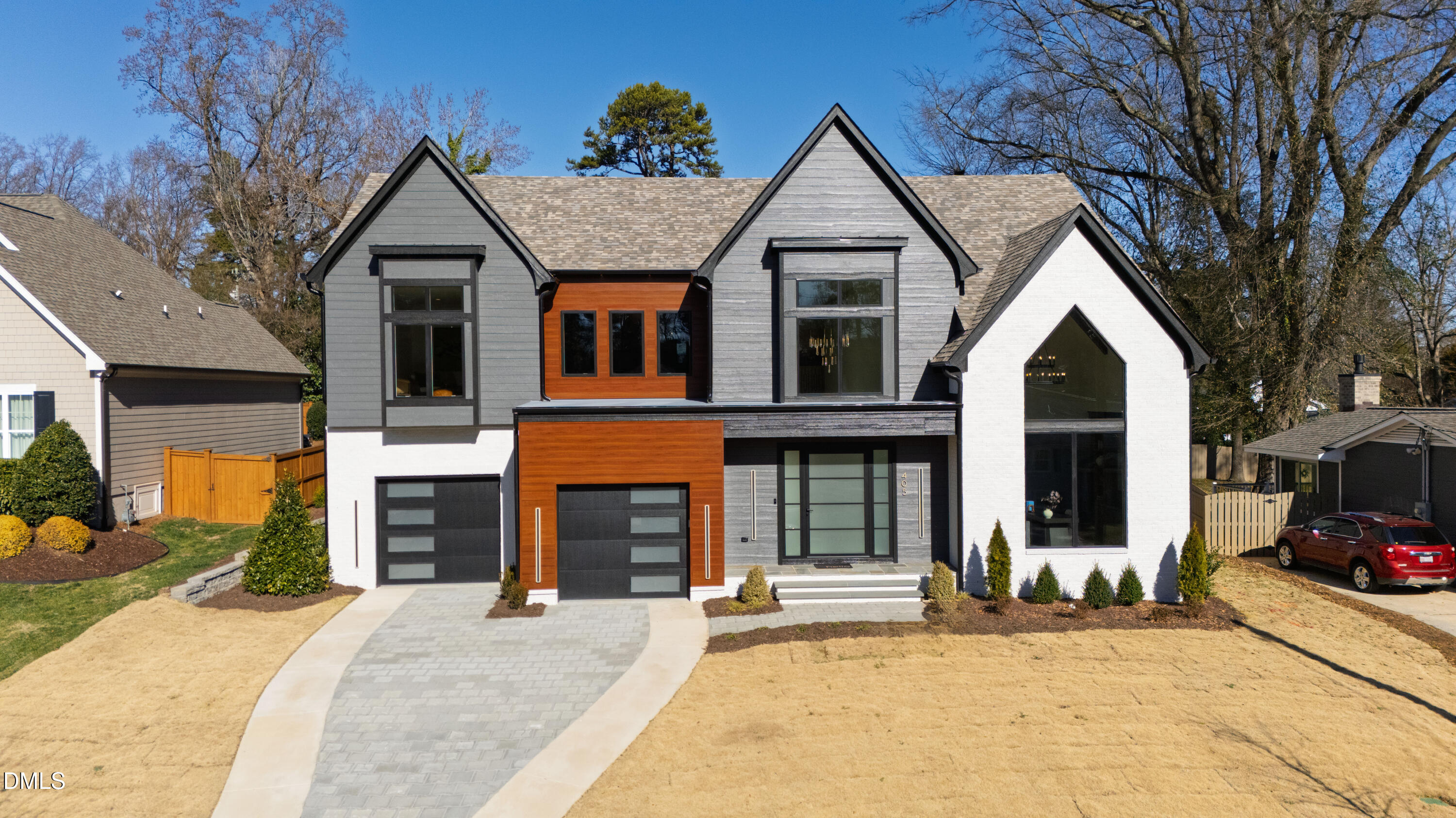405 Latimer Road Raleigh, NC 27609 - Photo 93 of 100 a front view of a house with a yard and garage