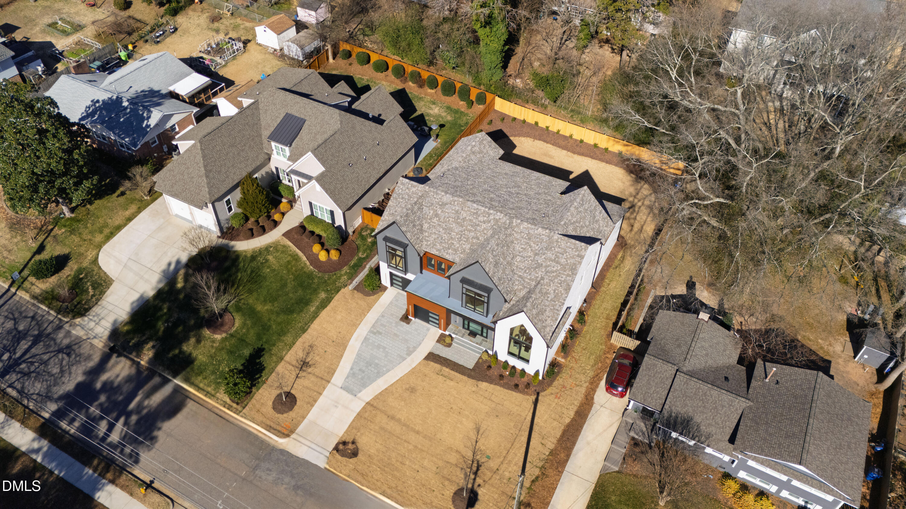 405 Latimer Road Raleigh, NC 27609 - Photo 96 of 100 an aerial view of a house with a yard and wooden deck