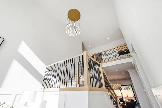 a kitchen with a table chairs sink and cabinets