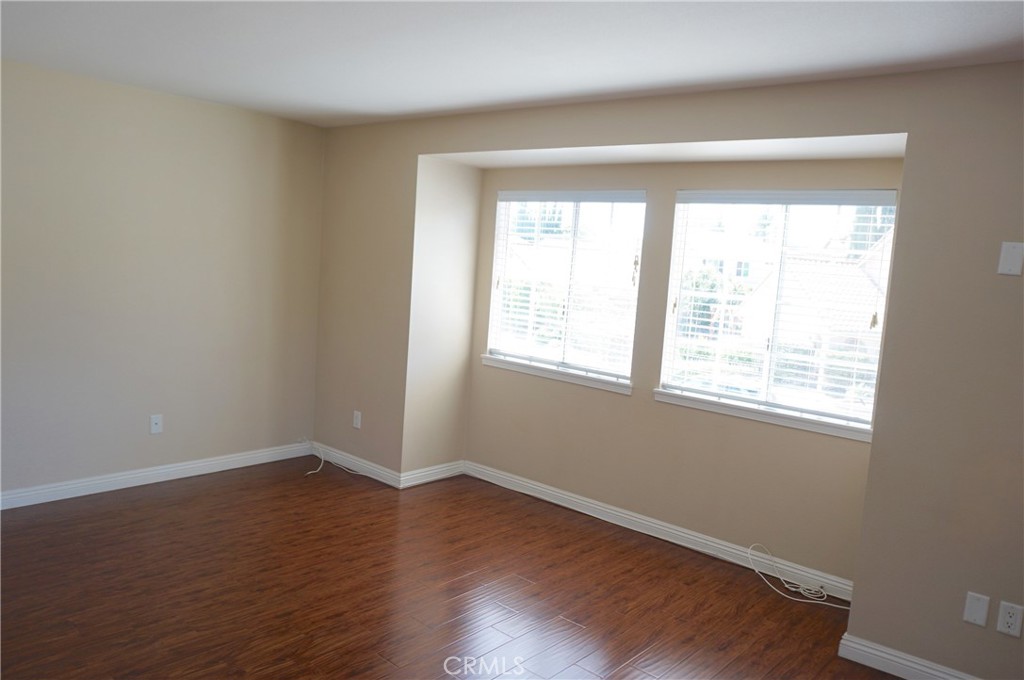 19584 Shadow Glen Circle Porter Ranch, CA 91326 - Photo 43 of 72 a view of a room with wooden floor and a window