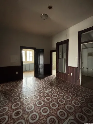 a view of empty room with windows
