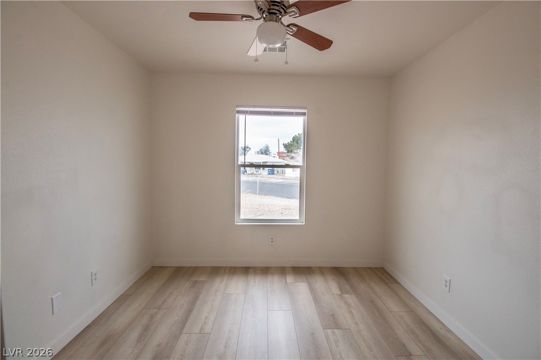 119 West Victory Road Henderson, NV 89015 - Photo 3 of 26 Bright, neutral-toned walls and wood-look flooring provide a versatile canvas for any interior design.
