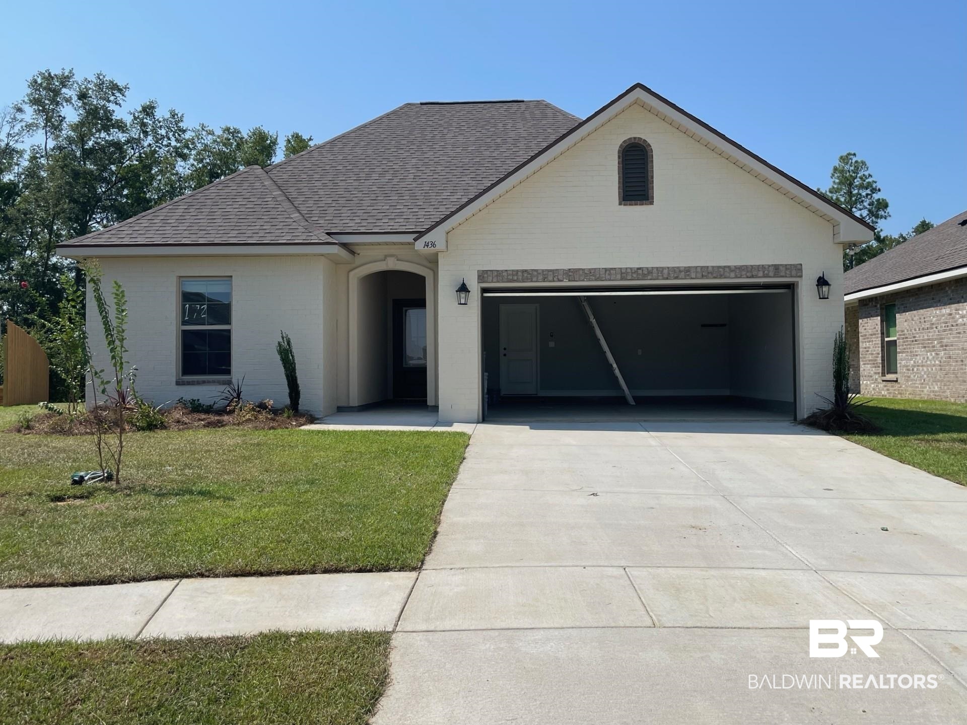 1436 Fenton Circle Foley, AL 36535 - Photo 1 of 3 View of front facade with a garage and a front yard