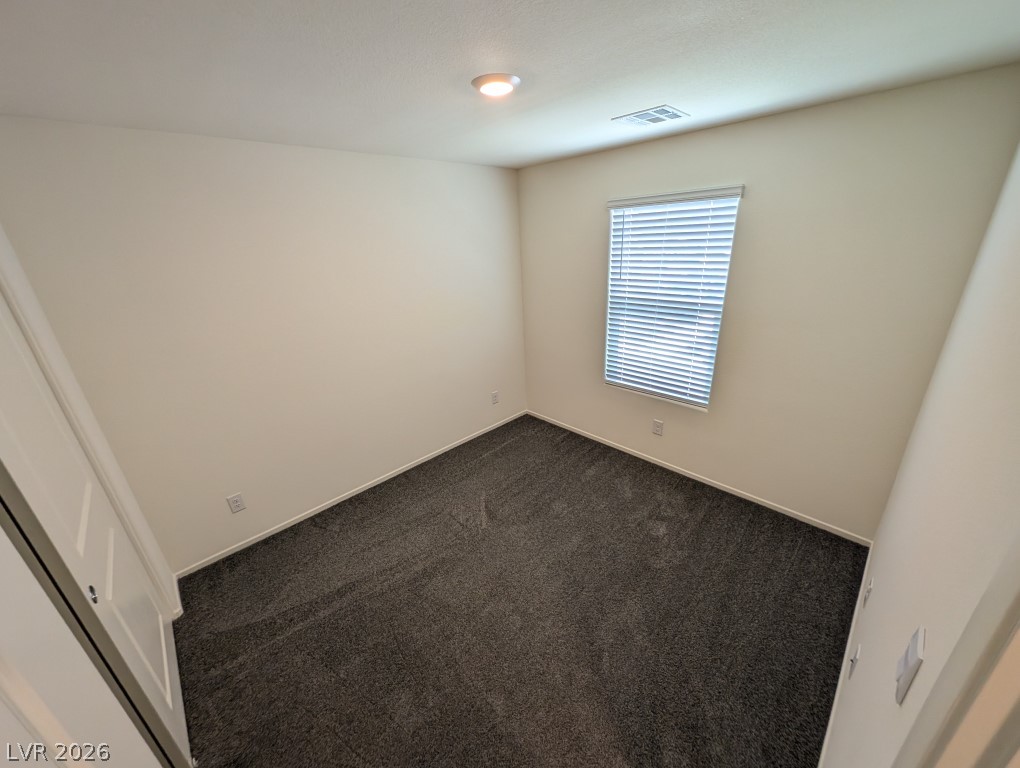 4820 Orchid Rdg Avenue Las Vegas, NV 89141 - Photo 22 of 27 A well-lit, quiet bedroom awaits personalization with its plush carpeting and inviting window.