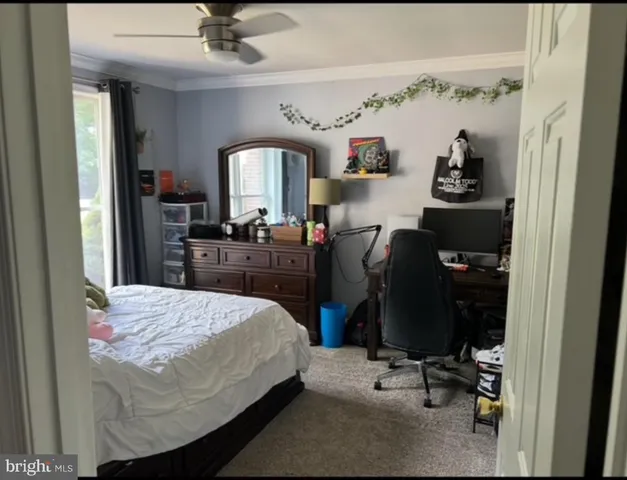 a bedroom with a bed and furniture