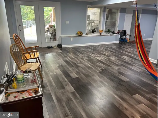 a view of living room filled with furniture and a window