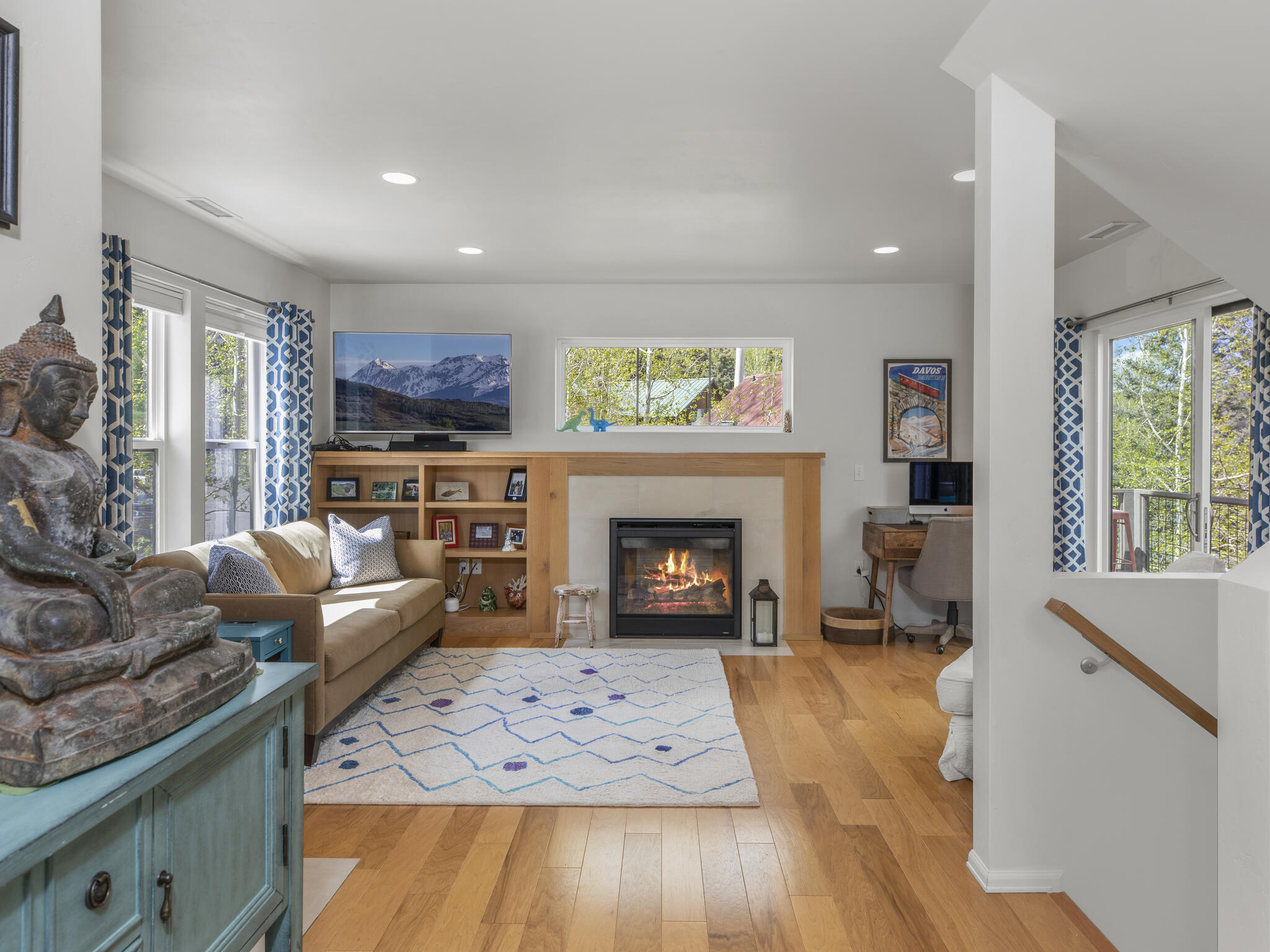 165 Alexander Overlook Telluride, CO 81435 - Photo 6 of 27 a living room with furniture and a fireplace