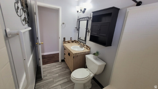 1525 South 400 East, Unit 63 Springville, UT 84663 - Photo 20 of 36 Bathroom with vanity, wood tiled floors, and a shower