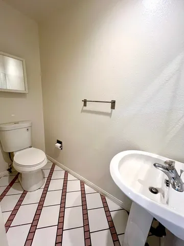 a bathroom with a sink and a toilet