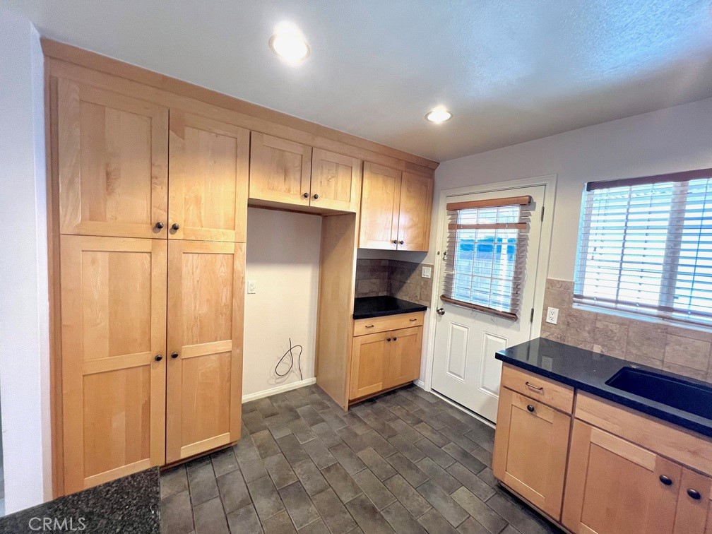 2909 Front Street Alhambra, CA 91803 - Photo 22 of 34 a kitchen with stainless steel appliances a refrigerator and a sink