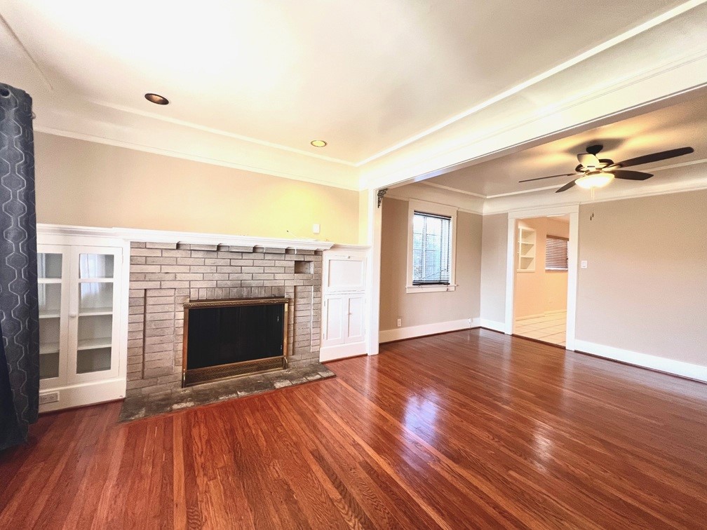 2909 Front Street Alhambra, CA 91803 - Photo 7 of 34 a view of an empty room with wooden floor fireplace and a window