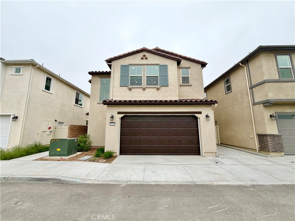 26893 Rubicon Road Menifee, CA 92586 - Photo 3 of 32 a front view of a house with a yard and garage