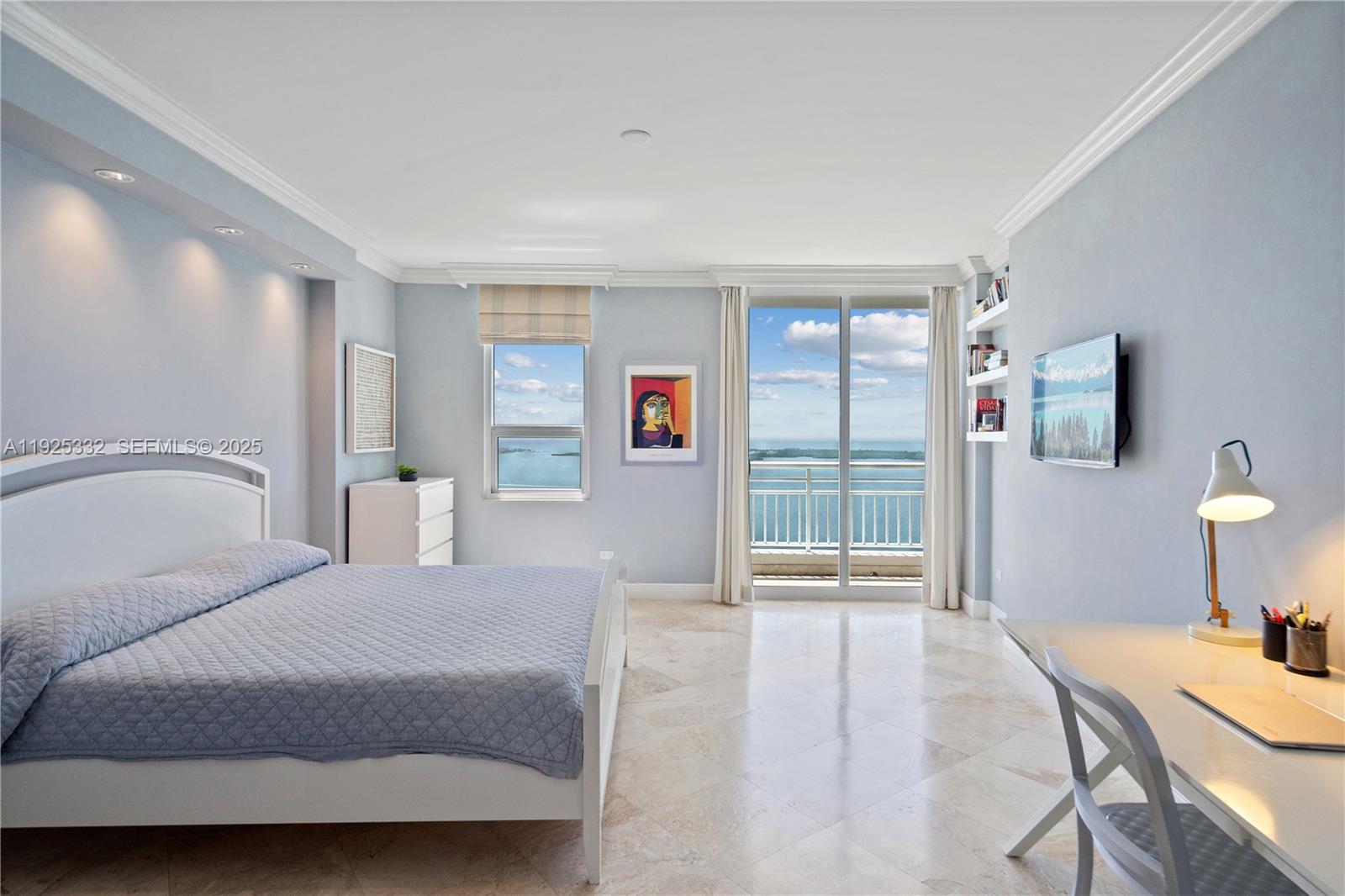 808 Brickell Key Drive, Unit 3304 Miami, FL 33131 - Photo 13 of 60 a spacious bedroom with a bed a lamp and a large window