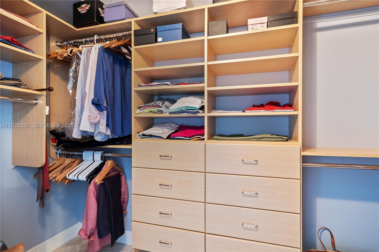 808 Brickell Key Drive, Unit 3304 Miami, FL 33131 - Photo 24 of 60 a view of walk in closet with clothes and shoes