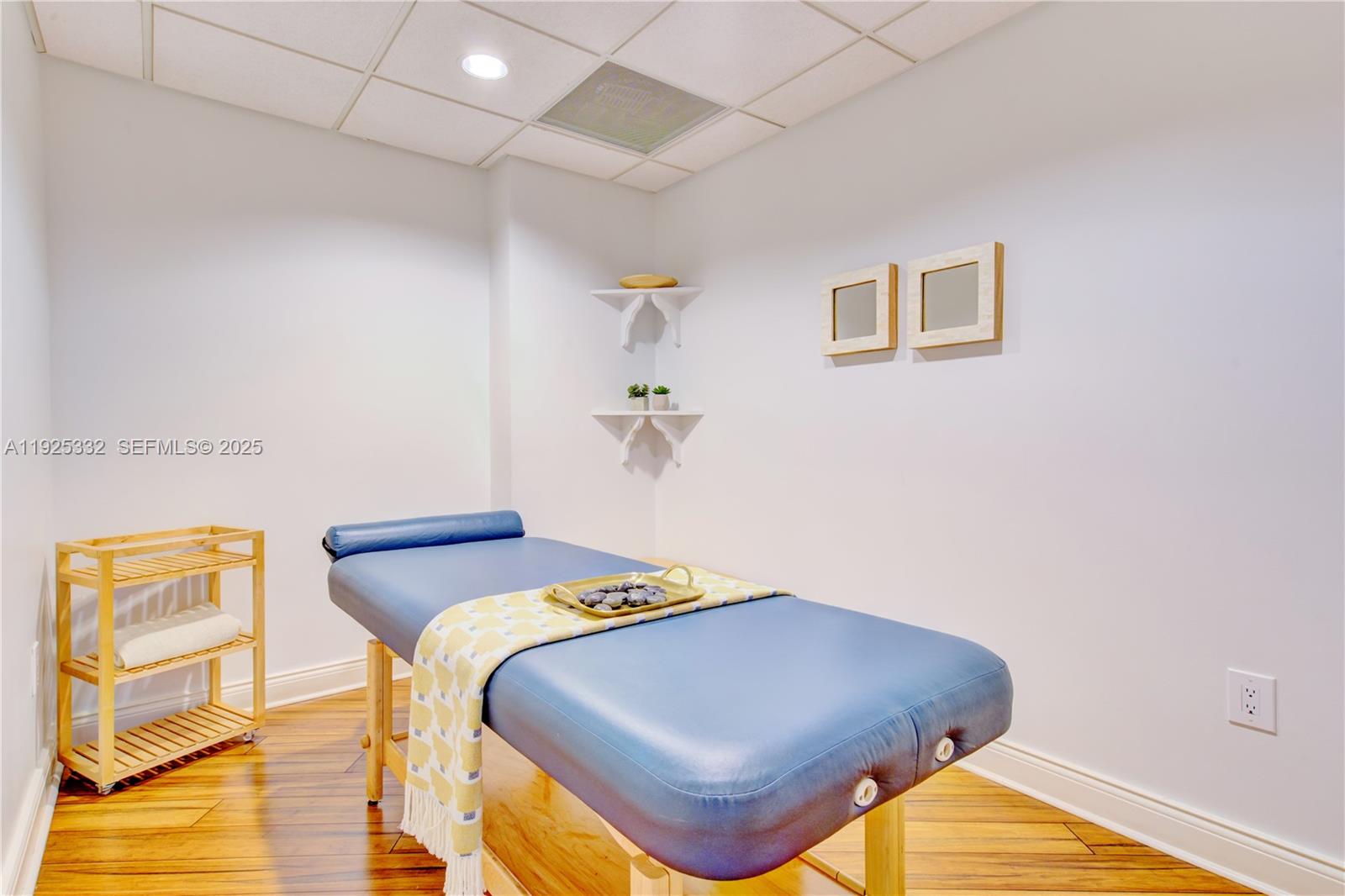 808 Brickell Key Drive, Unit 3304 Miami, FL 33131 - Photo 51 of 60 a bedroom with a bed and wooden floor