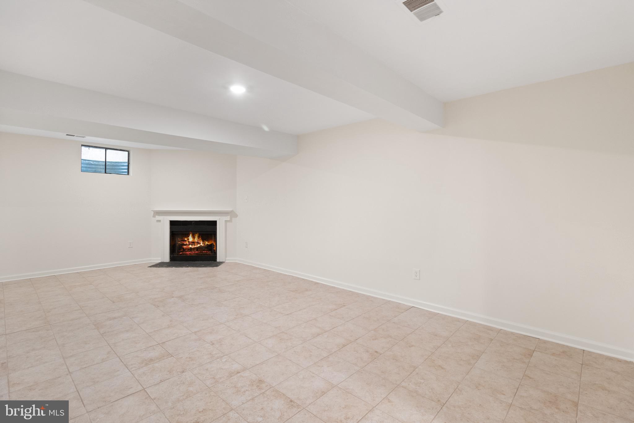 8581 Chester Grove Court Springfield, VA 22153 - Photo 32 of 38 a view of an empty room with a fireplace