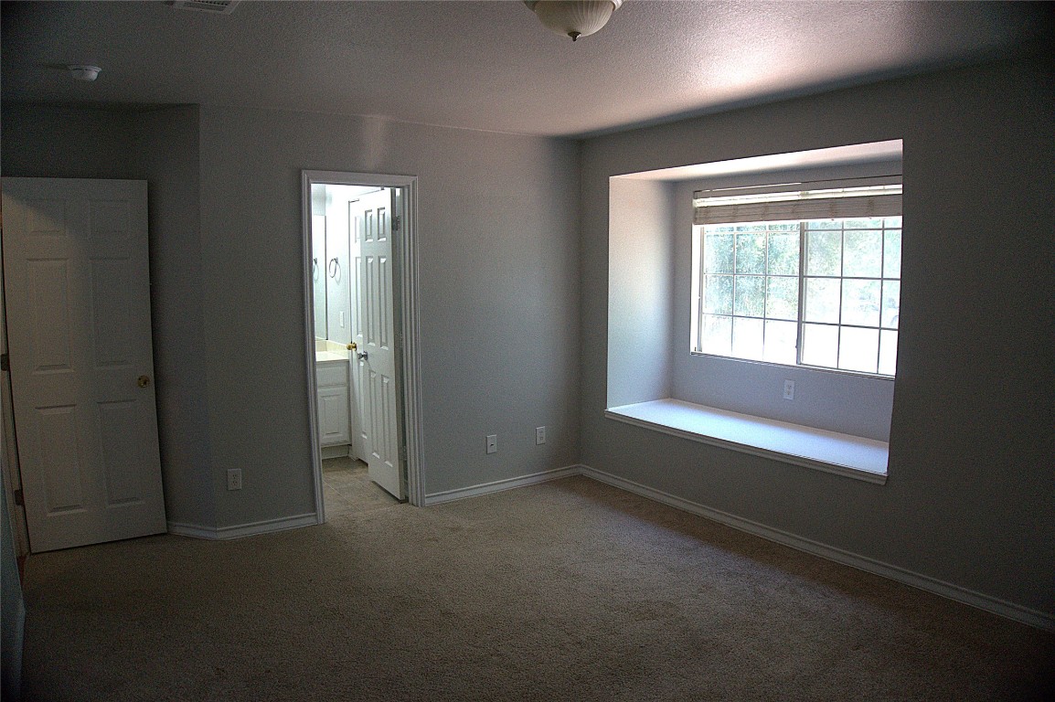 1512 Parkfield Circle Round Rock, TX 78664 - Photo 21 of 26 an empty room with windows