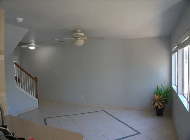 wooden floor in a hall with a window