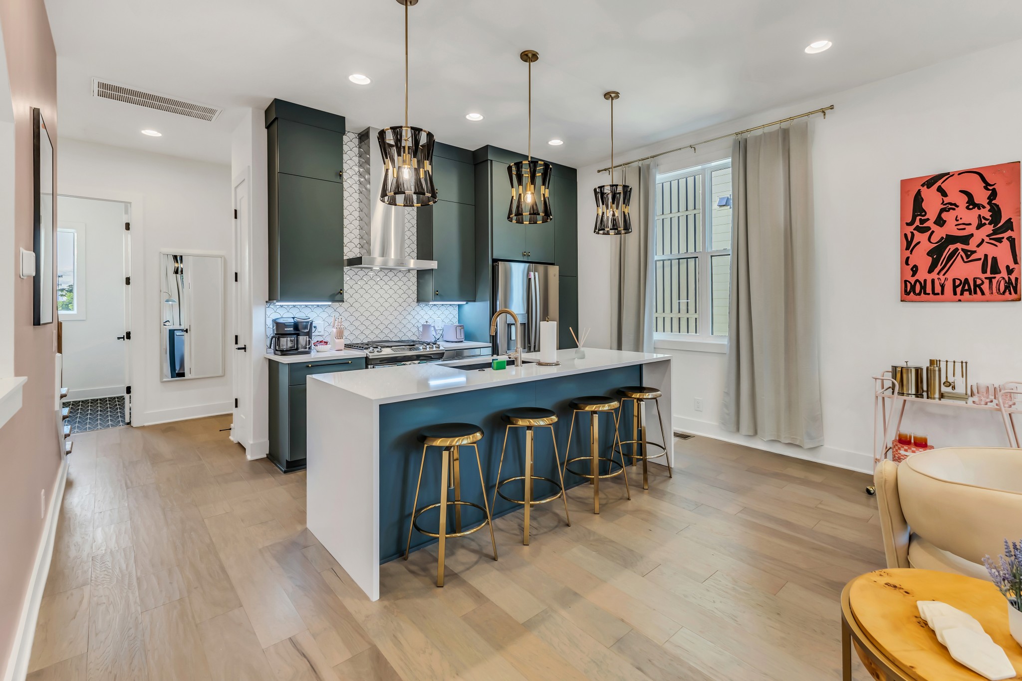2176 Carson Street, Unit 5 Nashville, TN 37211 - Photo 13 of 40 a kitchen with stainless steel appliances kitchen island granite countertop a stove a sink a refrigerator and a wooden cabinets