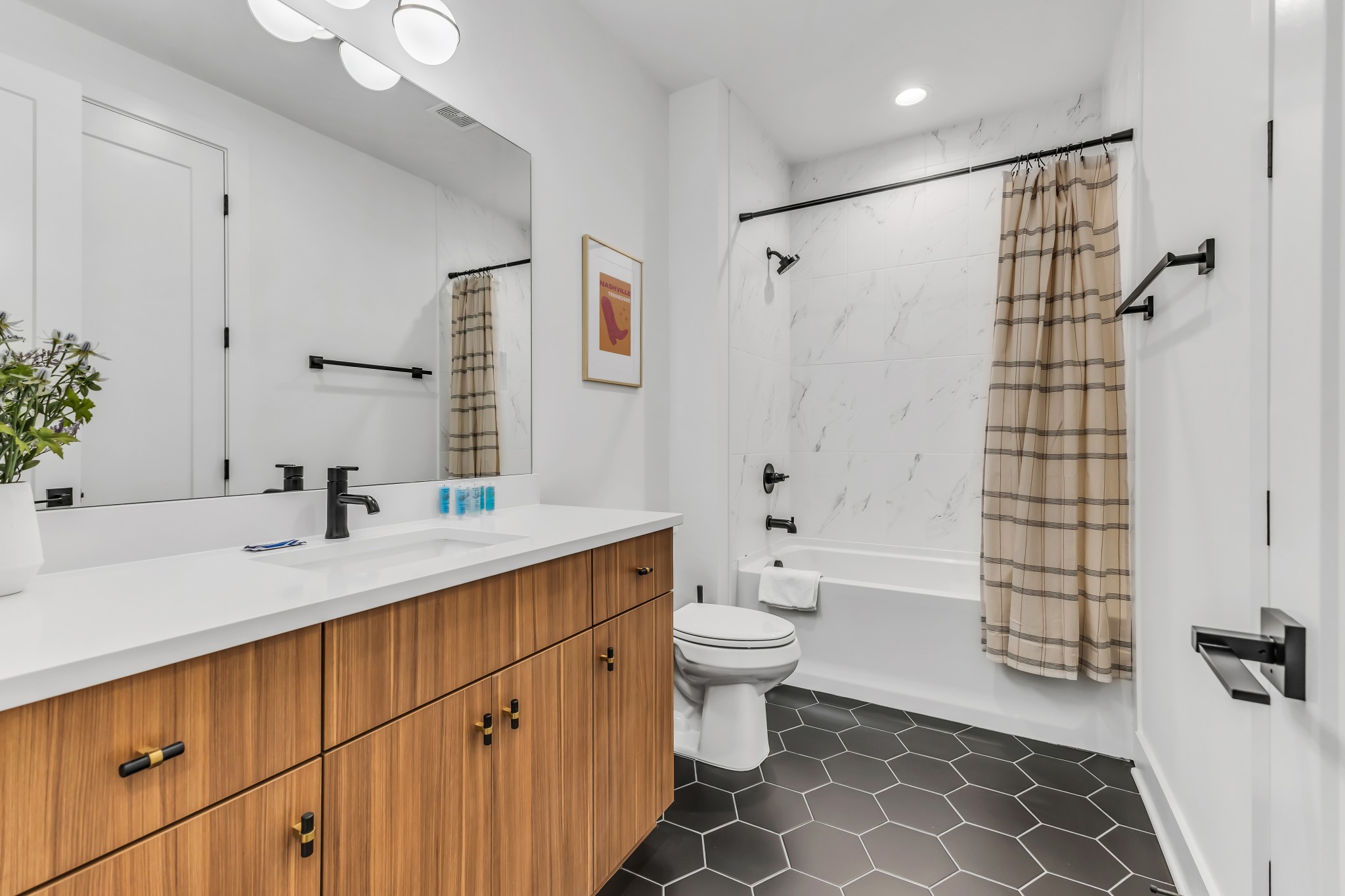 2176 Carson Street, Unit 5 Nashville, TN 37211 - Photo 25 of 40 a bathroom with a double vanity sink toilet mirror and shower