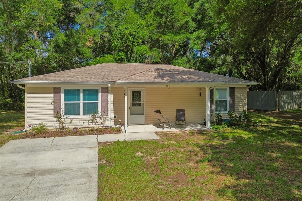 468 North Wheeler Avenue Inverness, FL 34453 - Photo 23 of 24 a front view of a house with yard outdoor seating and green space